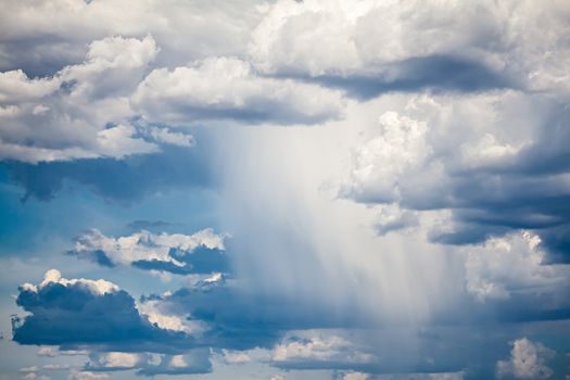 Photo of a dramatic sky with rain.