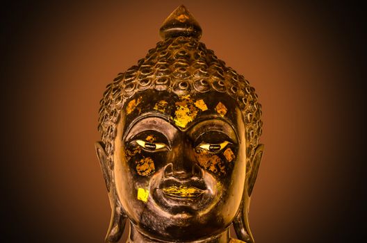 buddha head on brown light