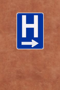 A hospital sign mounted on a wall