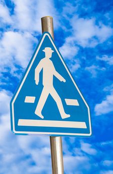 pedestrian blue traffic sign isolated on sky background