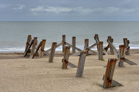 Wooden posts on beach