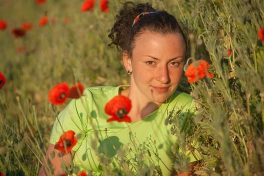 Young beautiful woman on cereal field in summer.