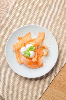 Salad with carrot and mozarella on the wooden table