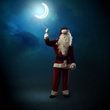 Santa Claus holding a string of luminous glowing moon