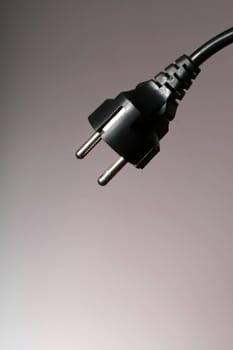 Electricity connector over brown background.