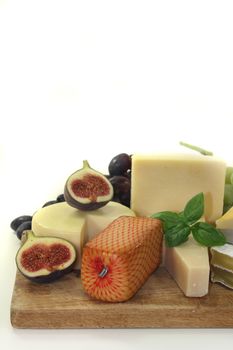 different types of cheese on a wooden board