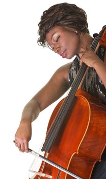 Serious Black female classical musician playing a cello