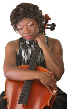 Sad African woman holding cello and looking down