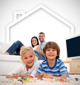 Loving family playing with toys in the living room with house illustration above them