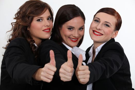 Businesswomen giving the thumb's up