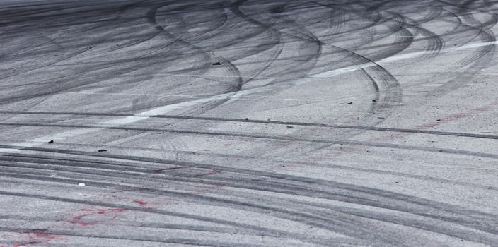 Background with tire marks on road track