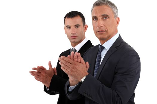 Businessmen clapping their hands