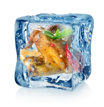 Chicken wings in ice cube isolated on a white background