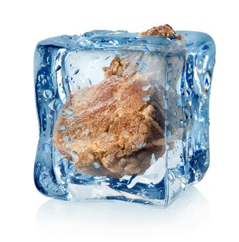 Roasted meat in ice cube isolated on a white background