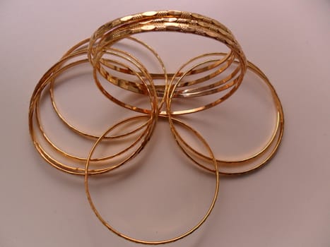 women's jewelry in the form of shiny metal
rings and rose gold color
