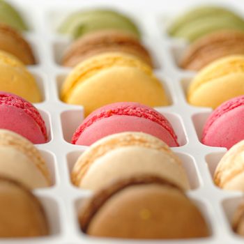 Colorful macaroons in white box