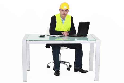 Architect sat by desk