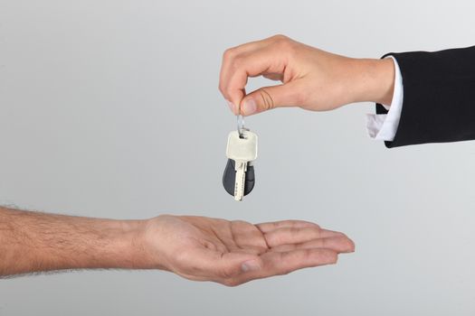 Estate agent handing over keys