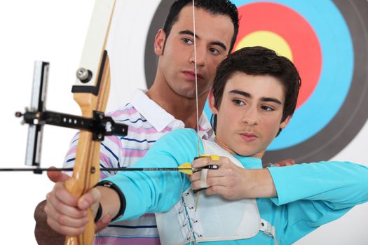Teen practicing archery