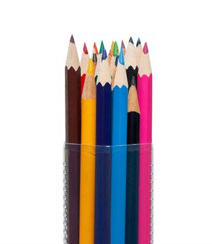 Colored pencils in a plastic transparent tube on the isolated background.