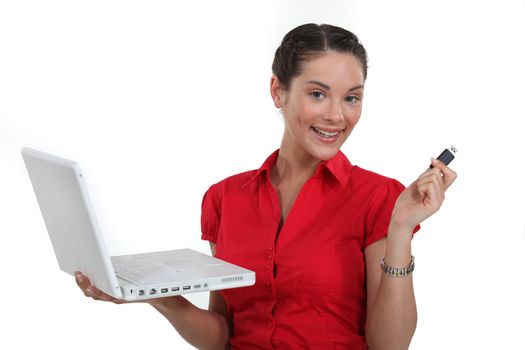 Woman with a laptop and usb key