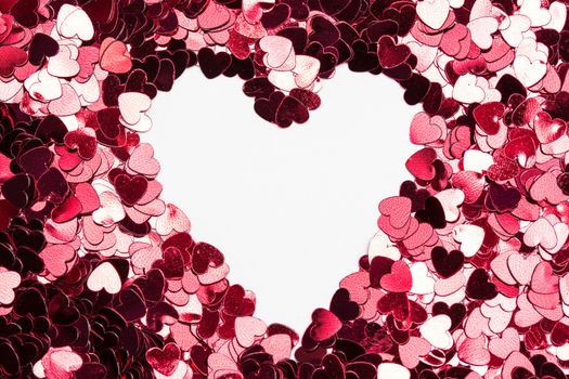 Inverted heart shape in pink confetti