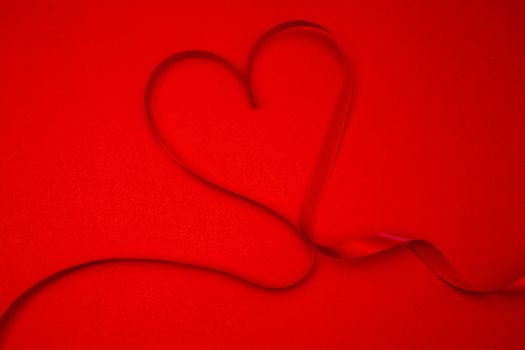Heart made out of ribbon in red