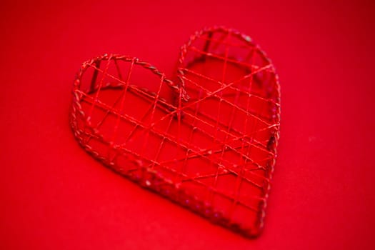 Heart shaped ornament box on red background