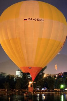 Hot air baloon landing on the lake