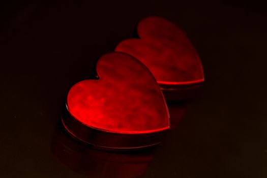 Red love hearts on black background