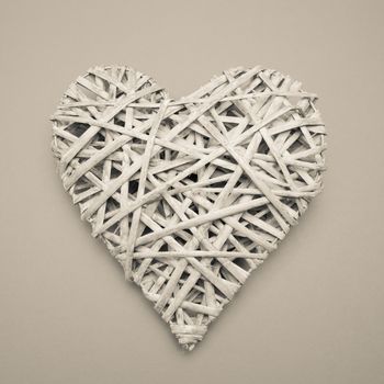 Wicker heart ornament on grey background