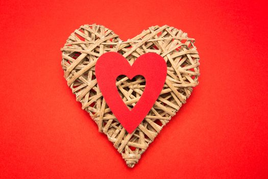 Wicker heart ornament with red paper cut out