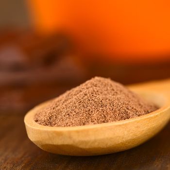 Cocoa powder on wooden spoon (Very Shallow Depth of Field, Focus one third into the cocoa)