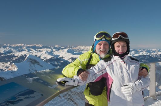 Alpine skiers mountains in the background. Ski resort of Kaprun, the Kitzsteinhorn Glacier. Austria