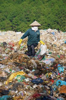 Many people make their live by pick up waste, someone pick up along street, these people concentrate at rubbish dump, they work all day here. Viet Nam- September 05, 2013