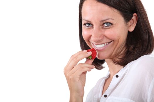 Woman holding strawberry