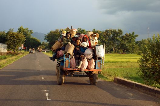 Cong Nong is one of farm vehicle of ethinic minority, after working day, all of them carry to go home by Cong Nong. Daklak, Viet Nam- September 02, 2013