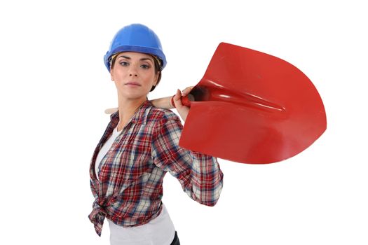 Woman with shovel over his shoulder