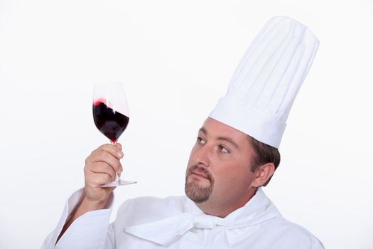 Chef with a glass of red wine