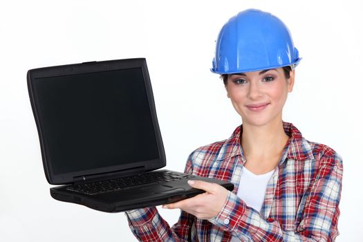 Female contractor holding laptop