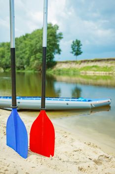 Red and blue paddles for white water rafting and kayaking