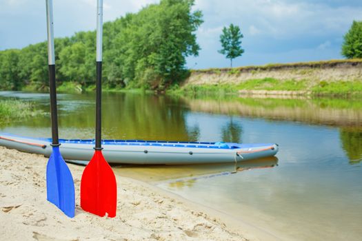 Red and blue paddles for white water rafting and kayaking