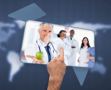 Hand selecting image of doctor holding apple on blue world map background