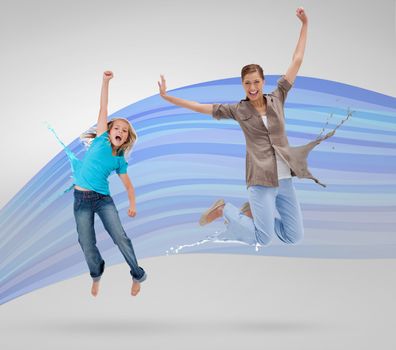 Woman and daughter jumping with clothes turning to paint splatters on blue wave background