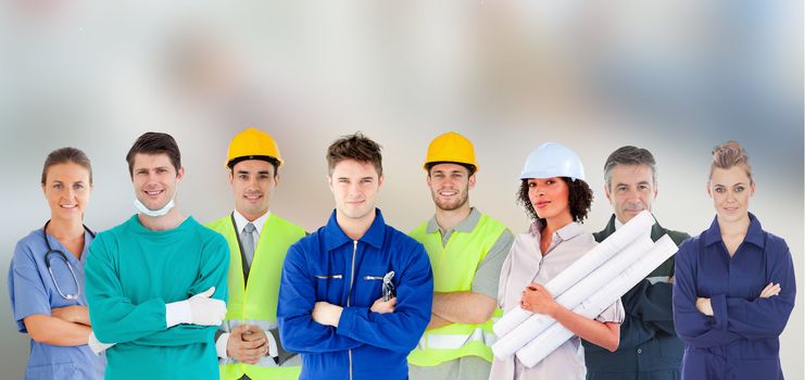 Group of people with different jobs standing with arms folded in line