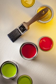 Interior Design - Emulsion paint tester-pots and paintbrush.