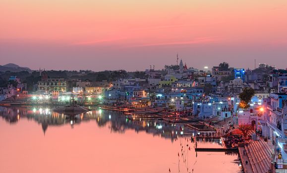 Pushkar Holy Lake at sunset.  Pushkar Lake or Pushkar Sarovar is located in the town of Pushkar in Ajmer district of the Rajasthan state of western India. Pushkar Lake is a sacred lake of the Hindus.