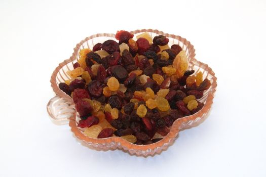 Close up of mixed dried fruit in a dish.