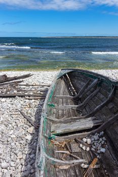 Old wooden boat on the seashore. Baltic sea, Fårö island, Sweden.