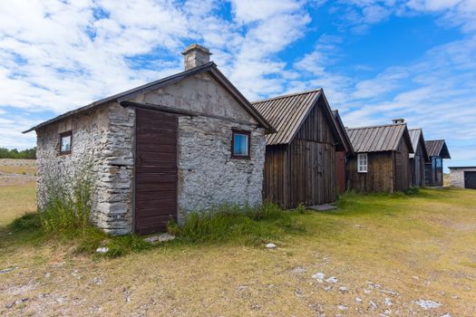 Old fishing village with wooden and stone houses on Fårö island, Sweden.